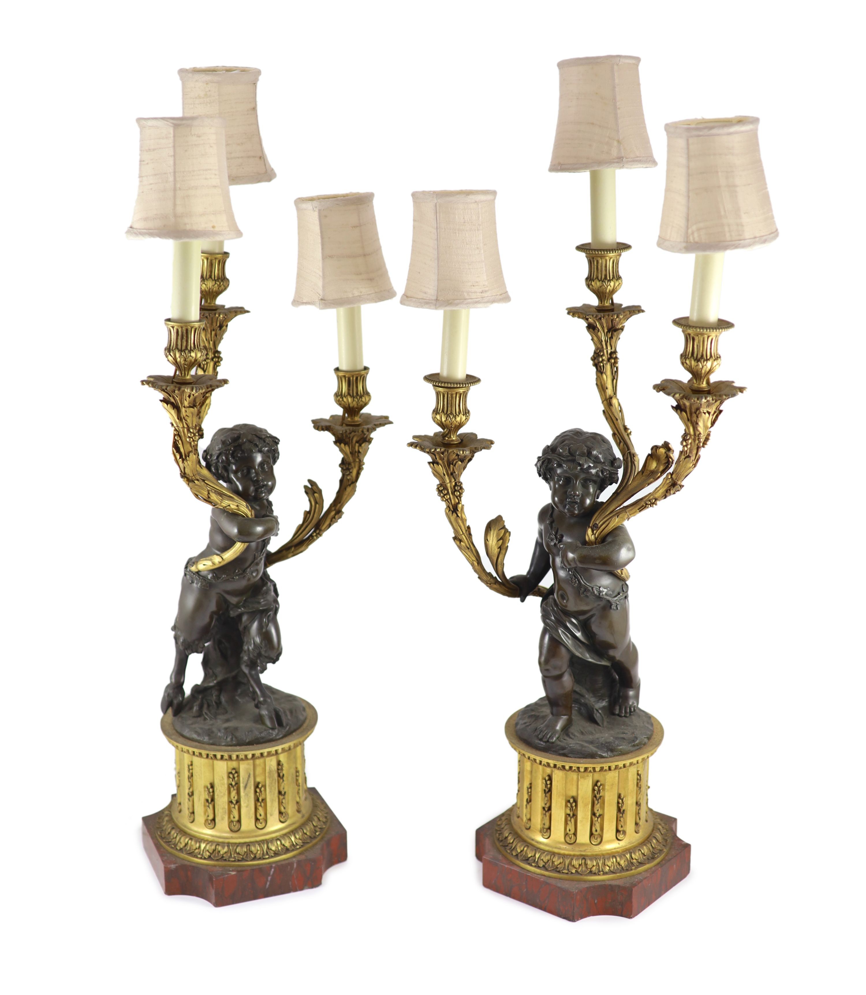 A pair of 19th century French bronze and ormolu three light candelabra, after Clodion height 66cm